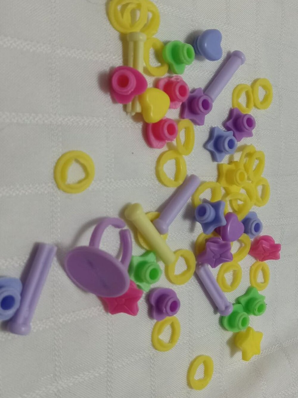 Set of vintage colored plastic staples for scrapbooking or art projects